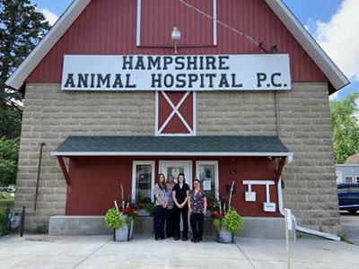 Employees standing in front of animal hosptial